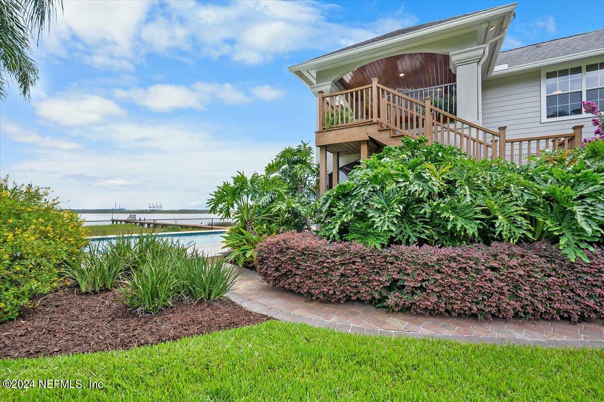 4295 Heath Road Jacksonville, FL 32277 - Photo 53 of 64 a front view of a house with a garden
