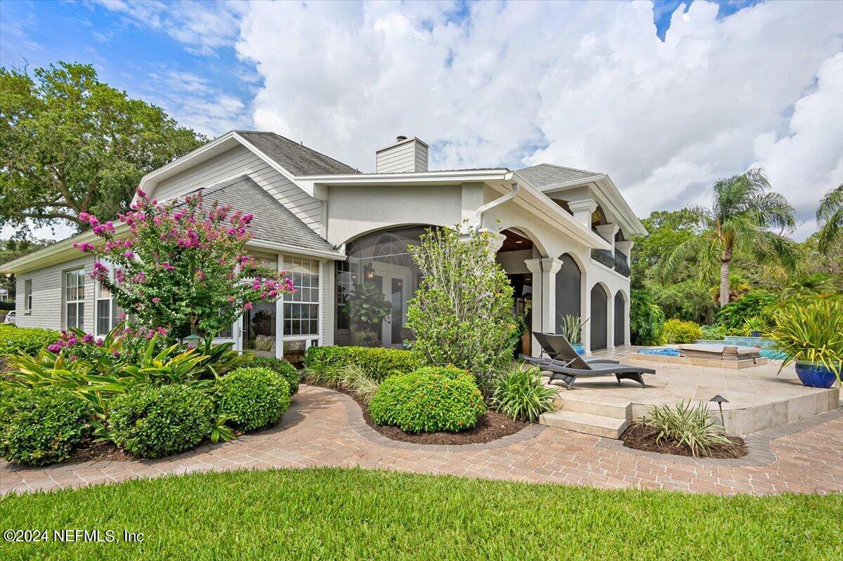 4295 Heath Road Jacksonville, FL 32277 - Photo 54 of 64 a front view of a house with garden