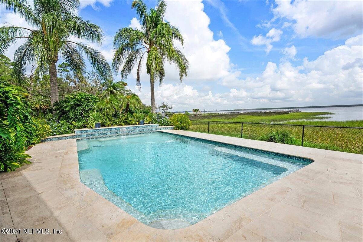 4295 Heath Road Jacksonville, FL 32277 - Photo 7 of 64 a view of a swimming pool with a yard