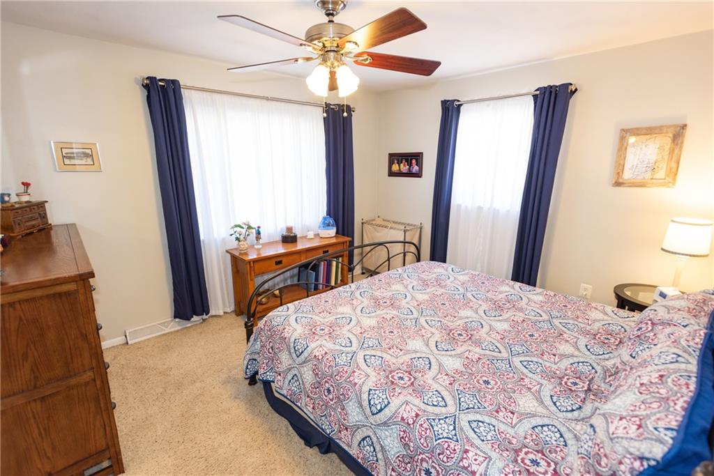 2011 Scheffel Road Pittsburgh, PA 15237 - Photo 14 of 29 a bedroom with a bed dresser and a large mirror