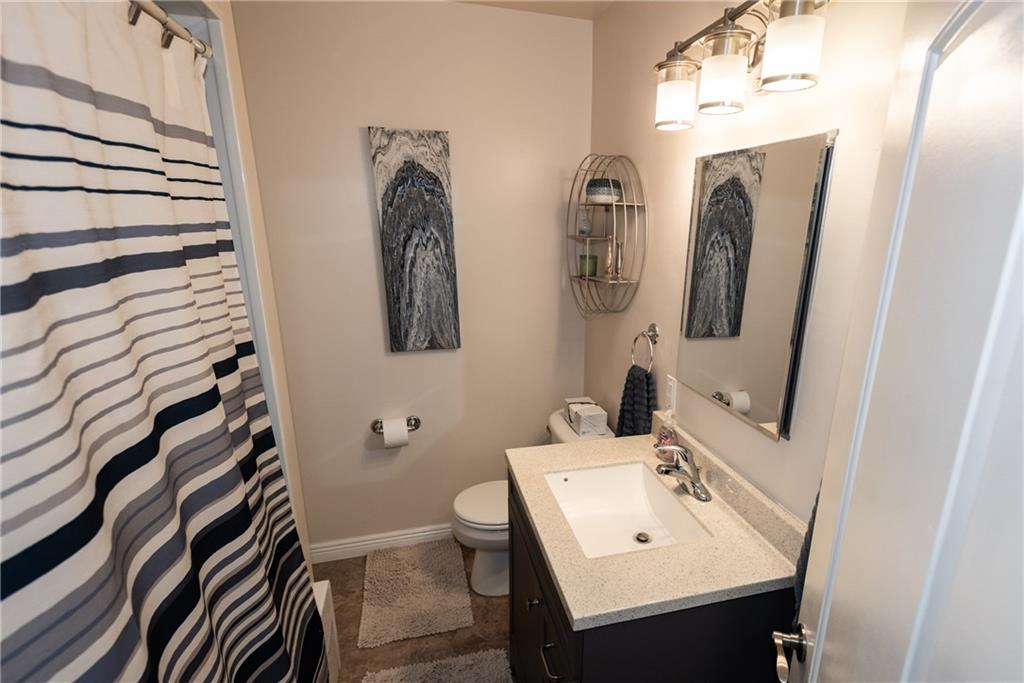 2011 Scheffel Road Pittsburgh, PA 15237 - Photo 16 of 29 a bathroom with a sink and mirror with toilet