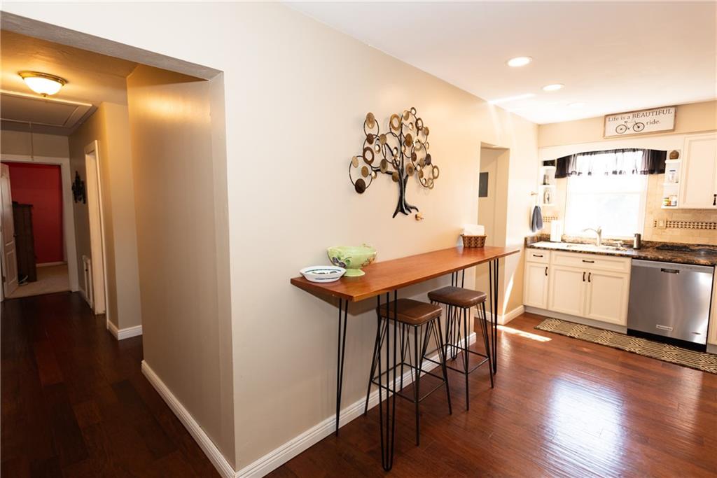 2011 Scheffel Road Pittsburgh, PA 15237 - Photo 10 of 29 a kitchen with stainless steel appliances a dining table chairs and wooden floor