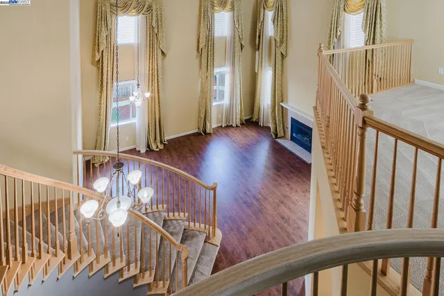 a large kitchen with stainless steel appliances granite countertop a stove a sink and a refrigerator