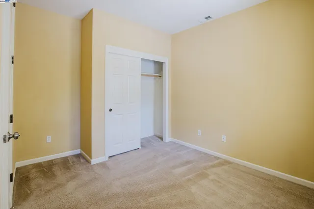 a view of a big room with windows