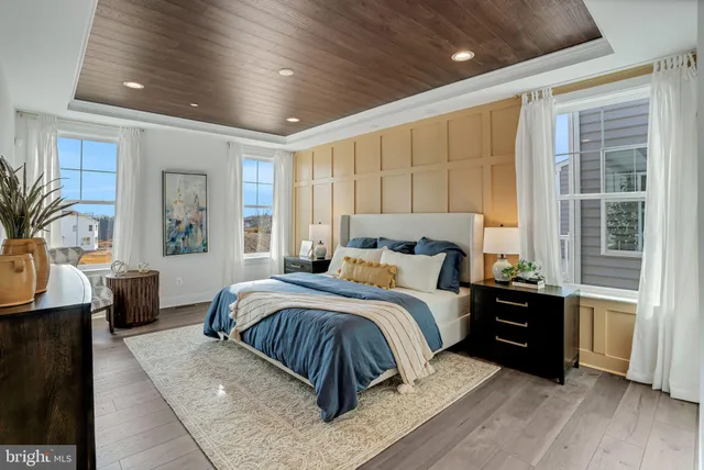 a bedroom with a bed and a couch