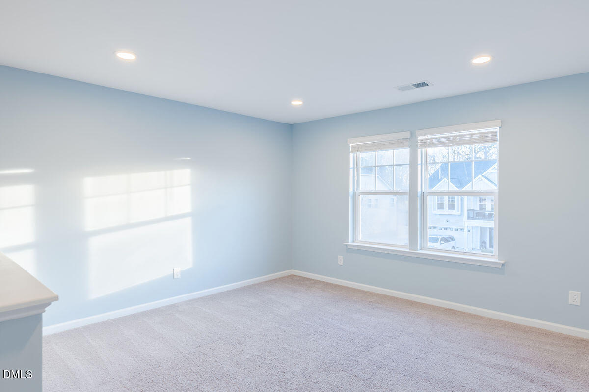87 East Ravano Drive Clayton, NC 27527 - Photo 19 of 37 an empty room with a window