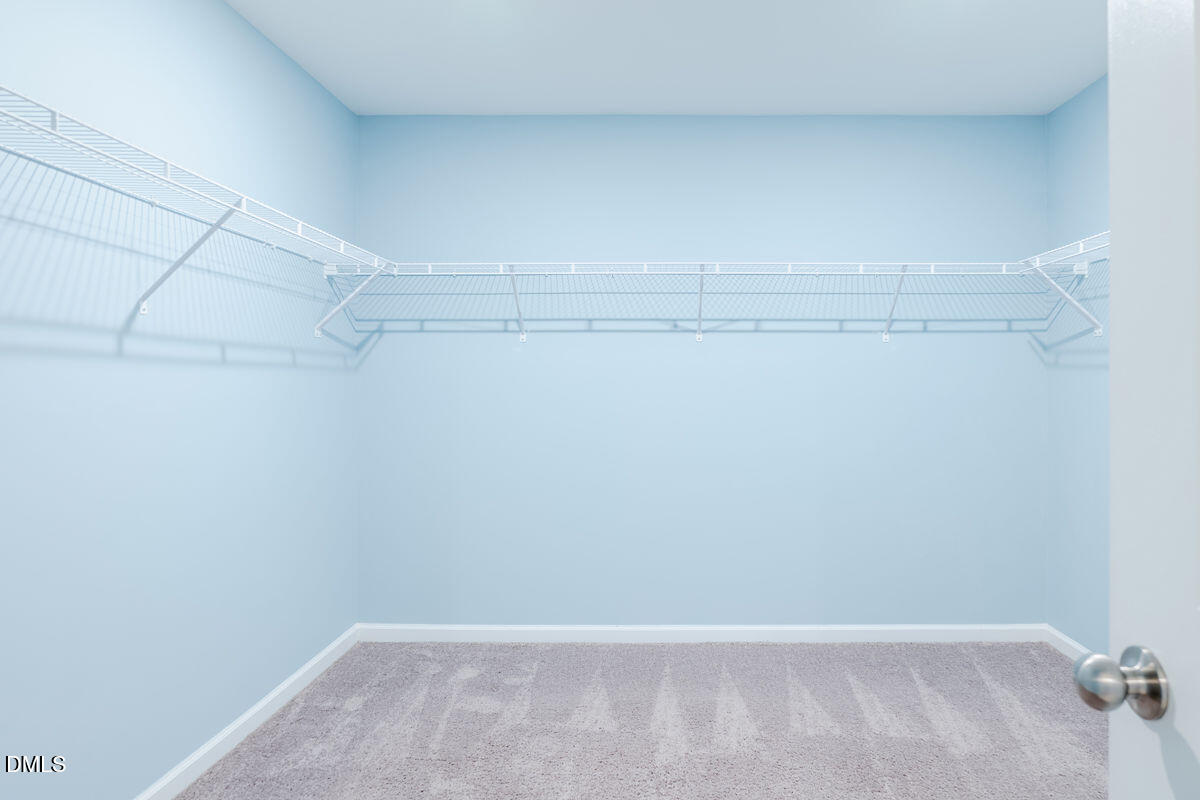 87 East Ravano Drive Clayton, NC 27527 - Photo 23 of 37 a view of a room with racks on the wall