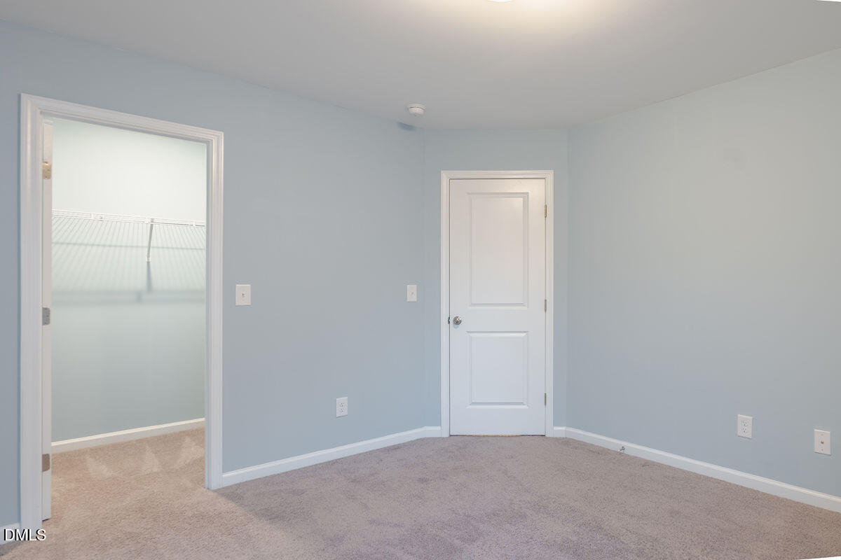 87 East Ravano Drive Clayton, NC 27527 - Photo 30 of 37 a view of an empty room