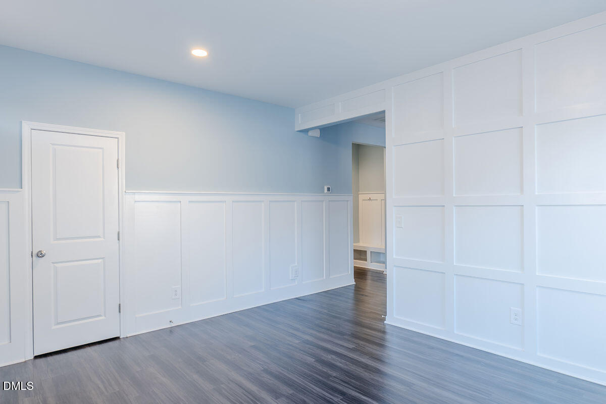 87 East Ravano Drive Clayton, NC 27527 - Photo 5 of 37 an empty room with wooden floor