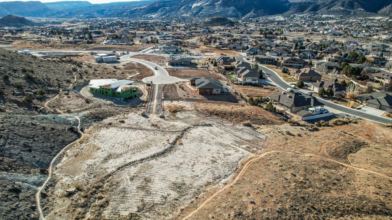 359 Canyon Rim Trail Grand Junction, CO 81507 - Photo 8 of 18 a view of a dry yard with wooden fence