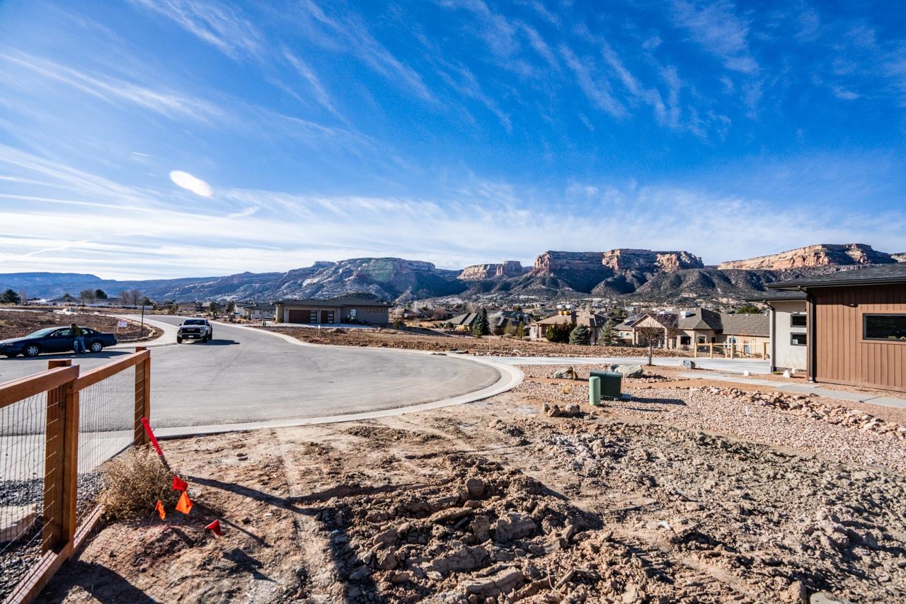 359 Canyon Rim Trail Grand Junction, CO 81507 - Photo 10 of 18 a view of a swimming pool with lawn chairs