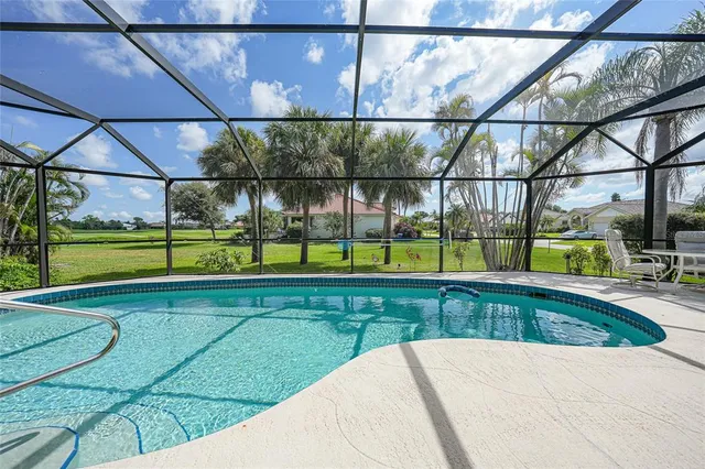 a view of yard with a swimming pool