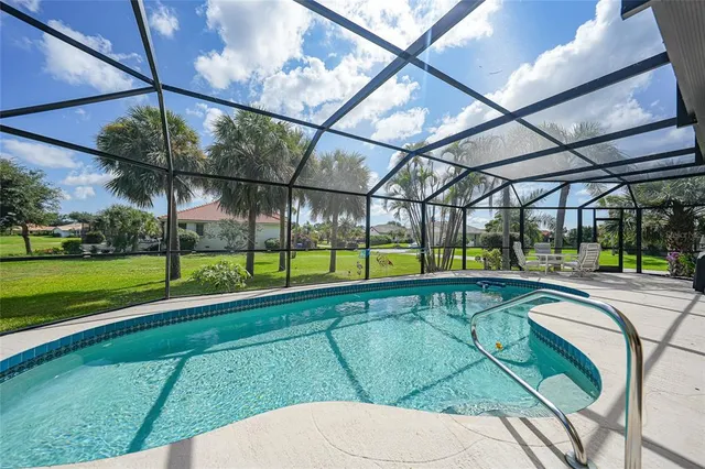 a view of a backyard with swimming pool