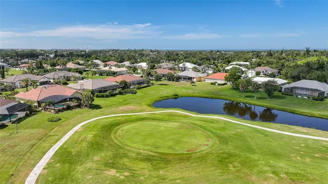 an aerial view of house with yard and mountain