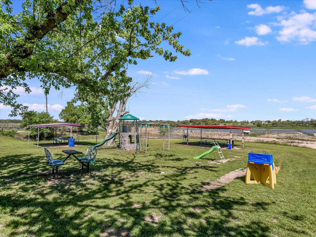 223 Golf Course Drive Spicewood, TX 78669 - Photo 23 of 38 a garden view with a lake view