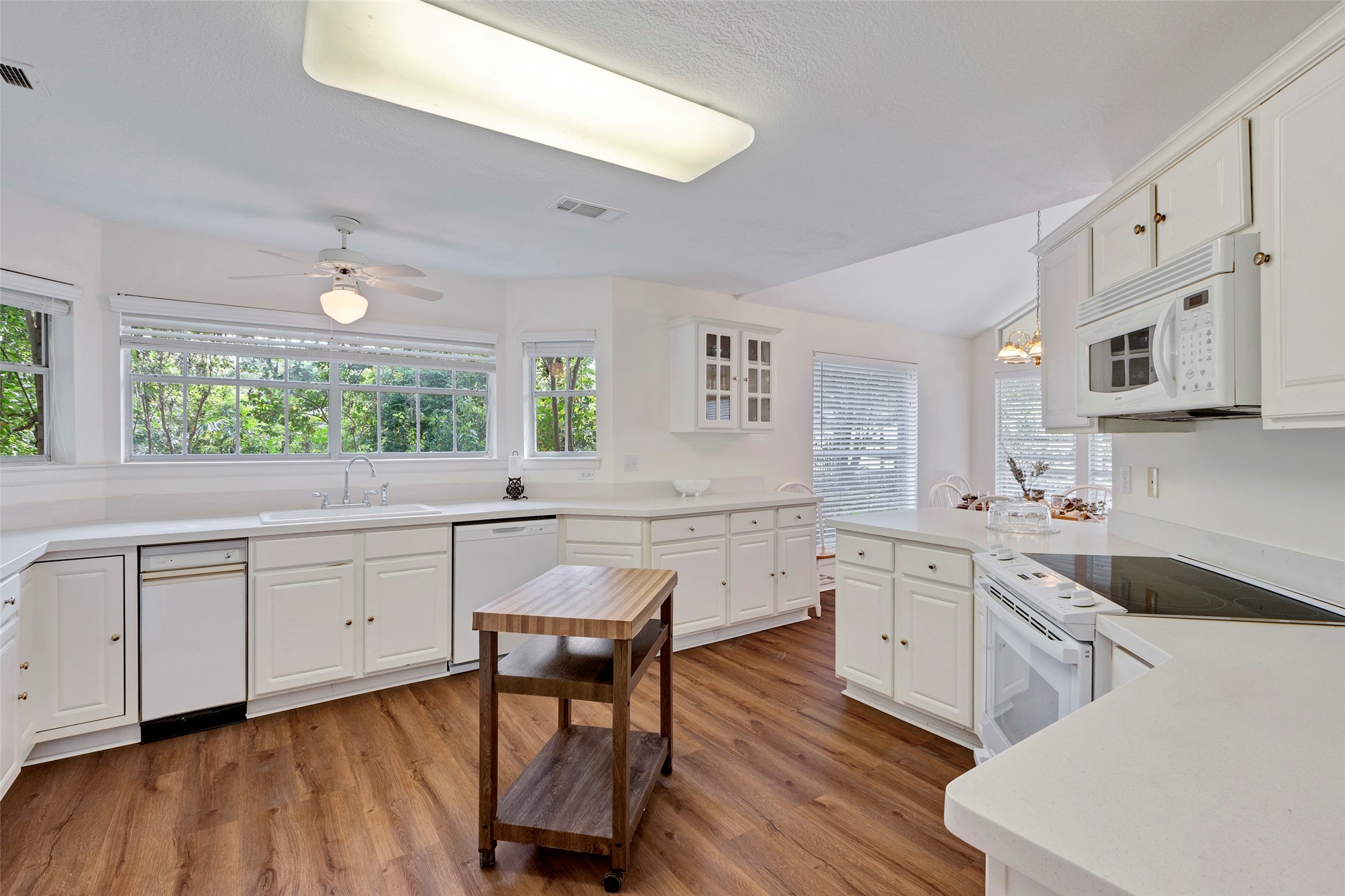 281 Harbor Run Drive Coldspring, TX 77331 - Photo 13 of 31 a kitchen with white cabinets and sink