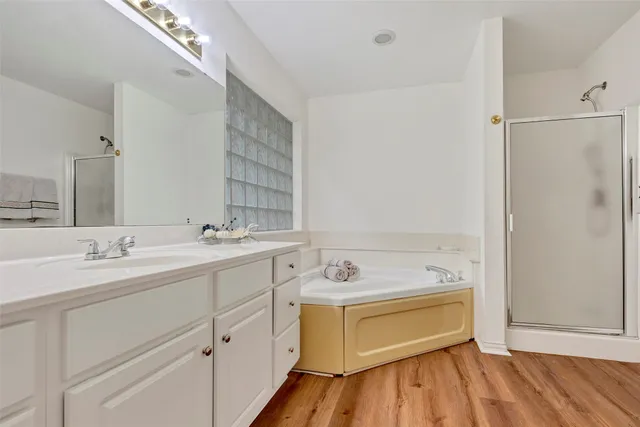 a bathroom with a sink double vanity and a mirror