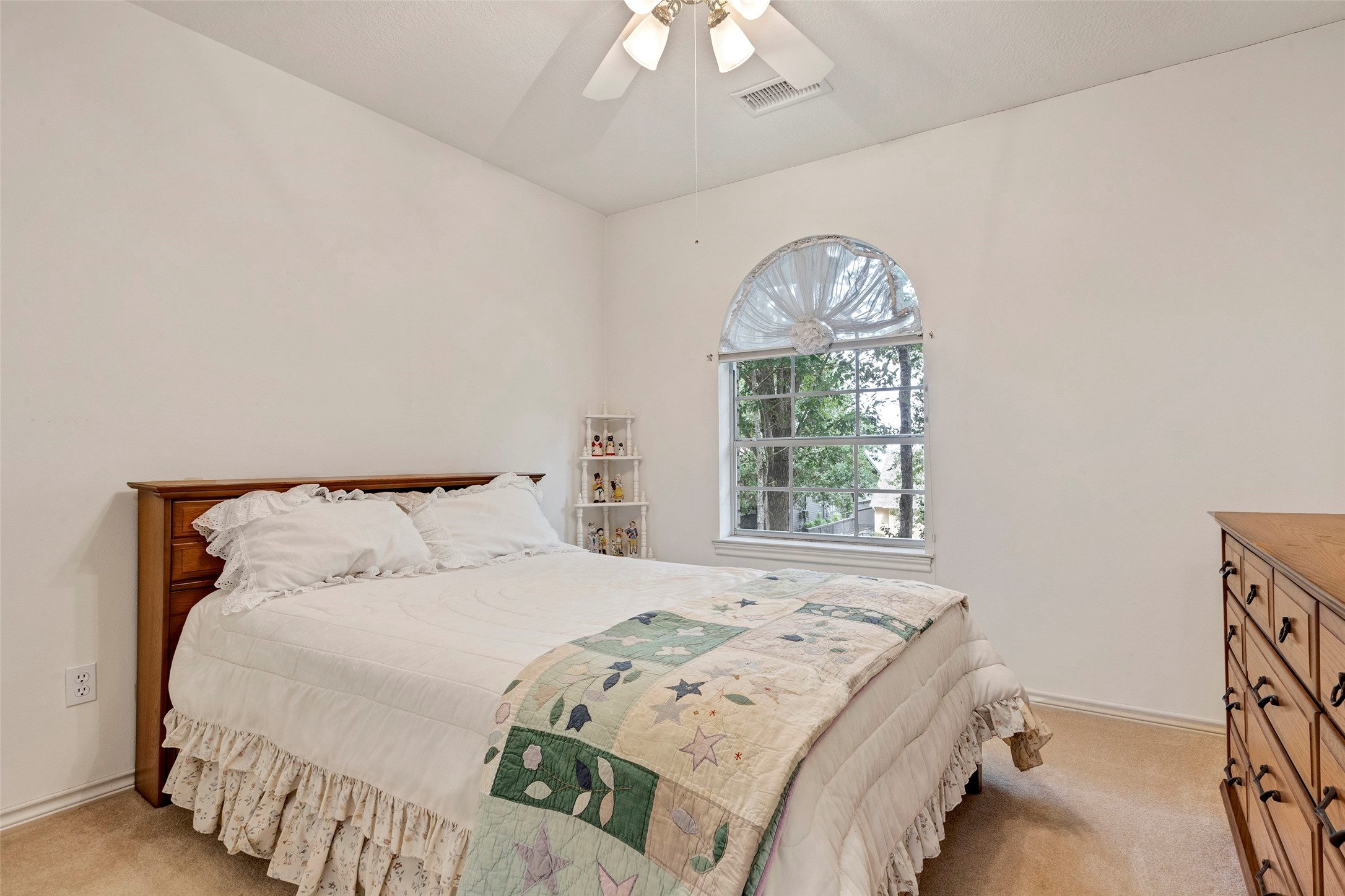 281 Harbor Run Drive Coldspring, TX 77331 - Photo 22 of 31 a bedroom with a large bed and a large window