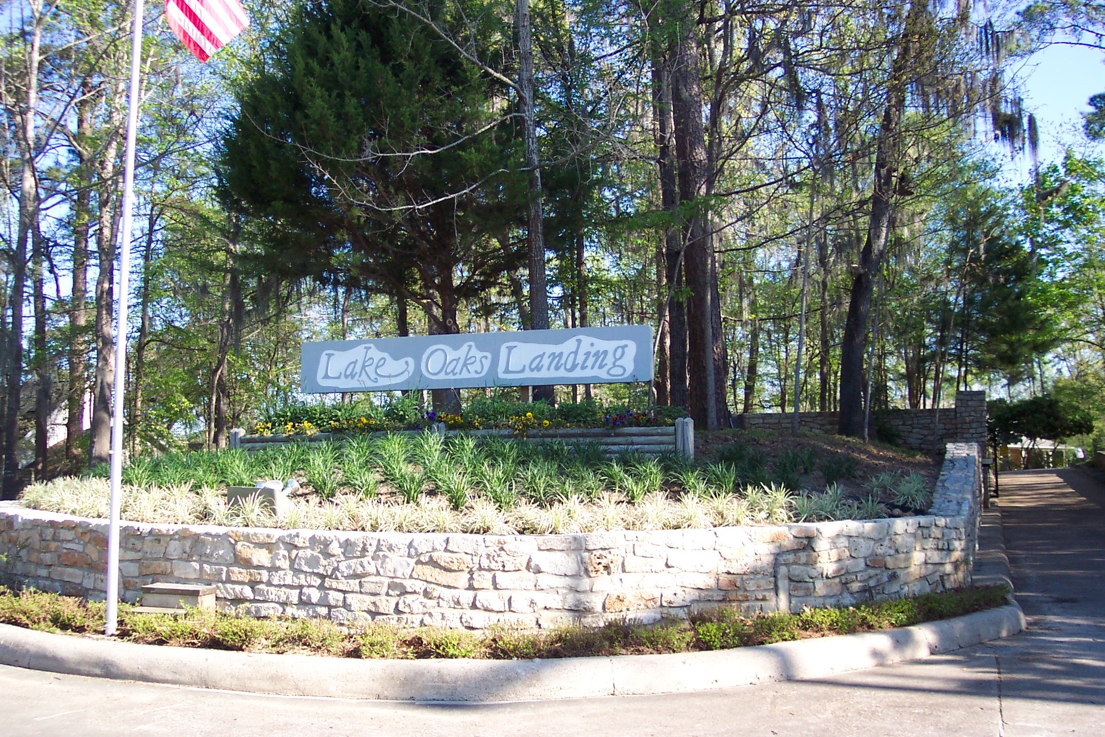 281 Harbor Run Drive Coldspring, TX 77331 - Photo 26 of 31 a front view of a house with garden