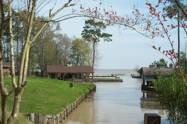 a view of house with garden space and sitting area