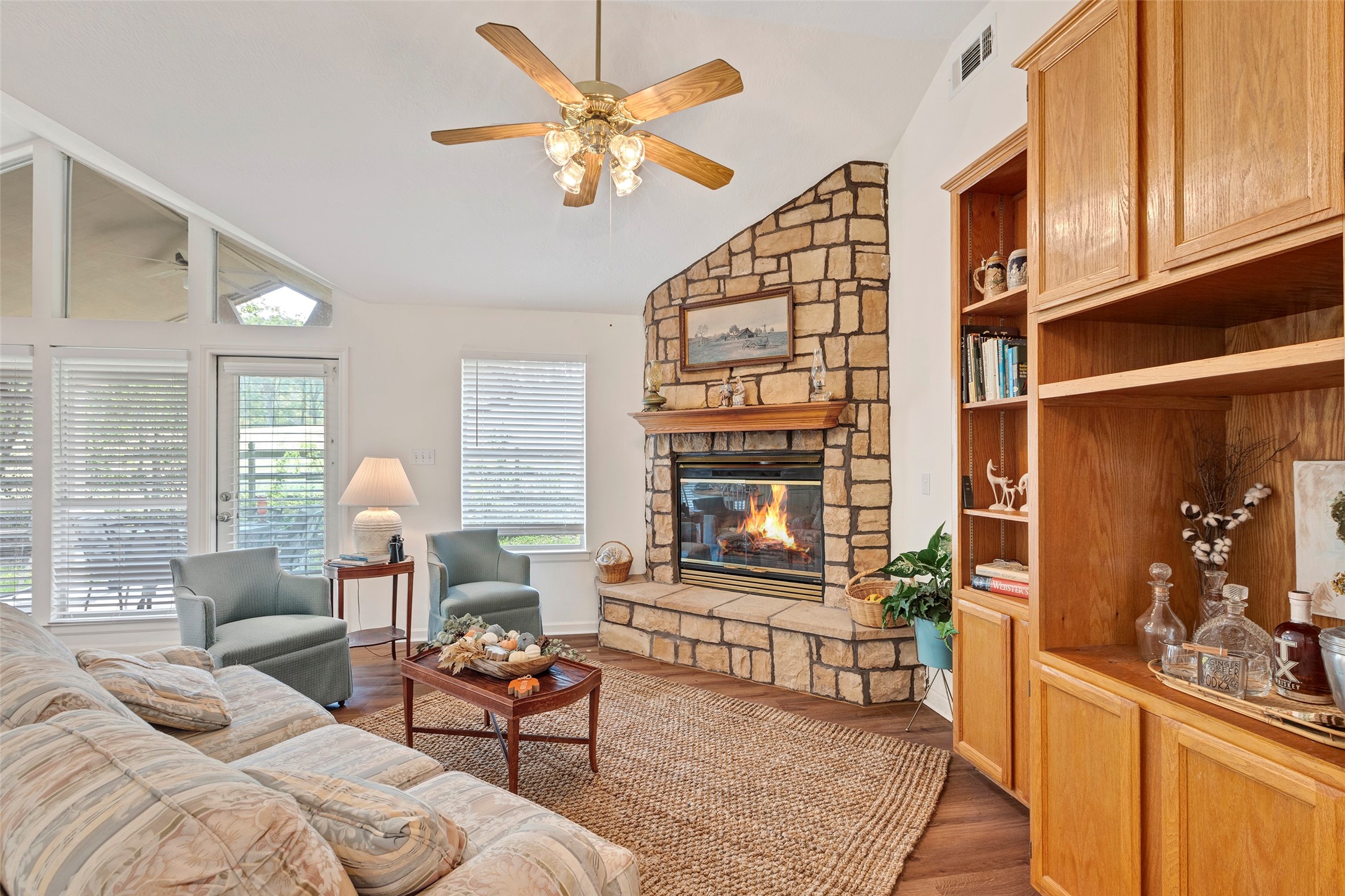 281 Harbor Run Drive Coldspring, TX 77331 - Photo 7 of 31 a living room with furniture a fireplace and a window