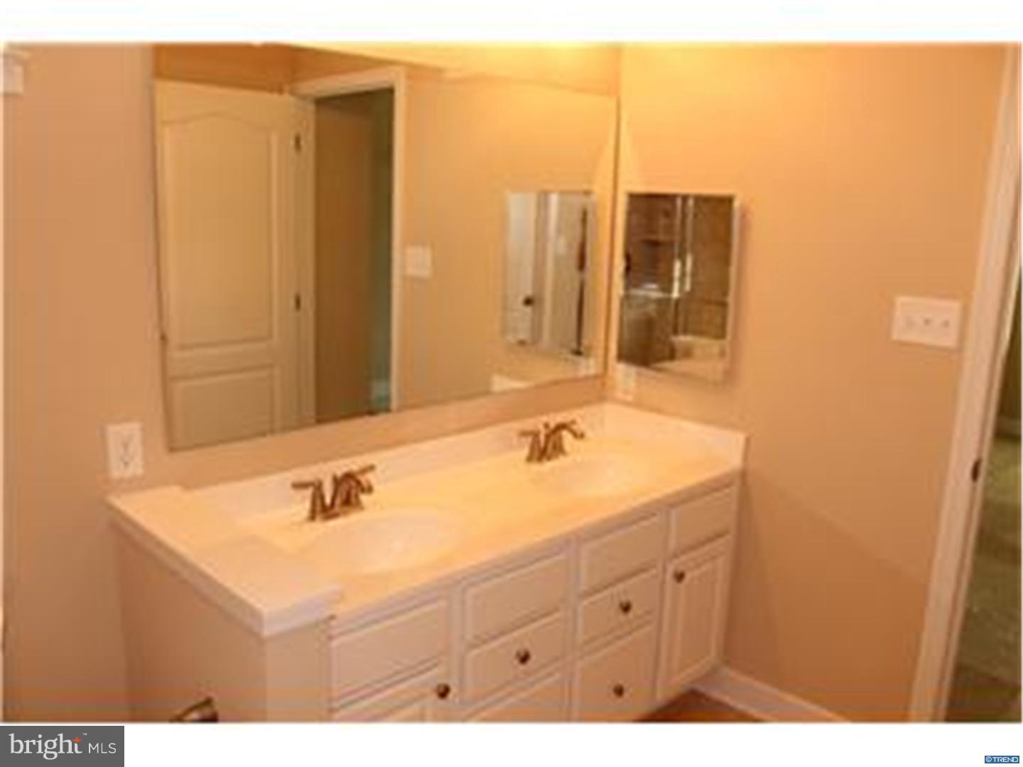 14 Marlyn Road Newark, DE 19713 - Photo 16 of 25 a bathroom with a sink mirror and vanity