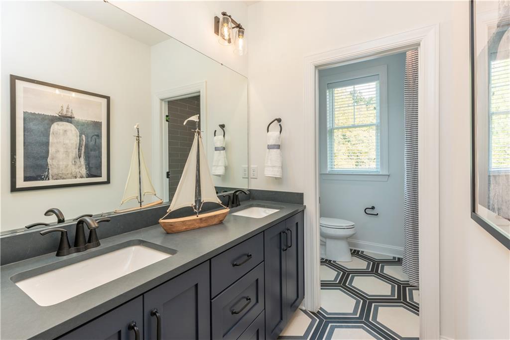 5136 Cline Hollow Road Export, PA 15632 - Photo 21 of 25 a bathroom with a granite countertop sink toilet and mirror