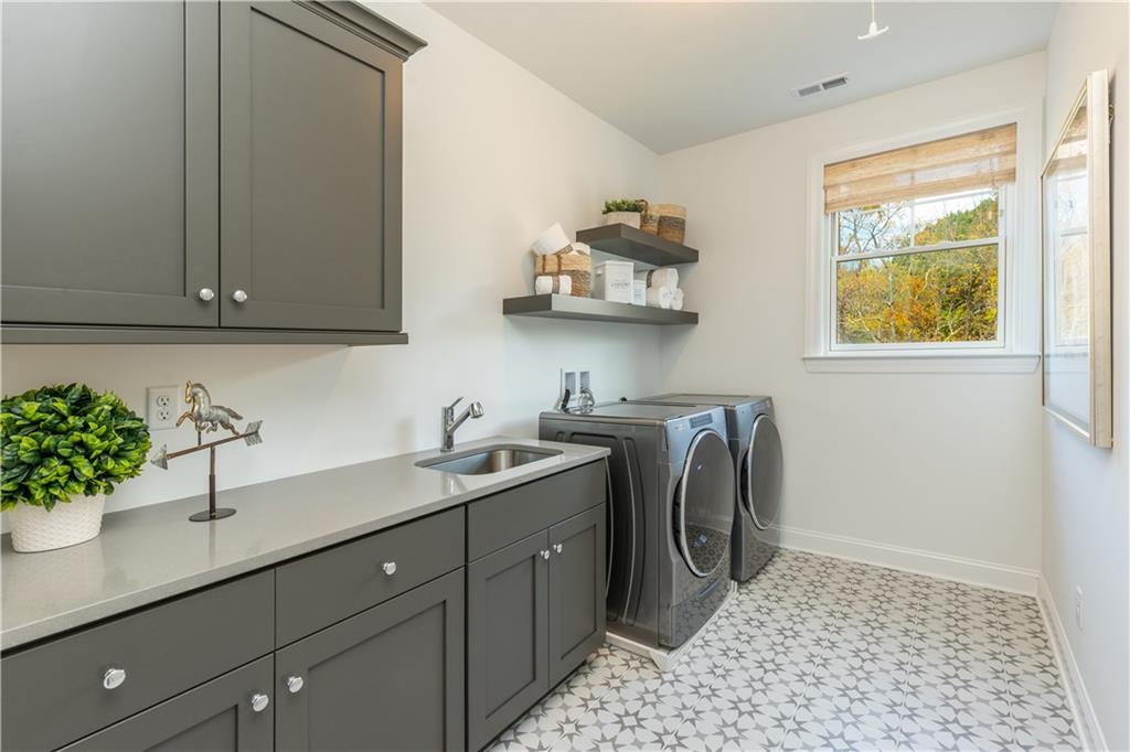 5136 Cline Hollow Road Export, PA 15632 - Photo 23 of 25 a utility room with a sink a washer and dryer