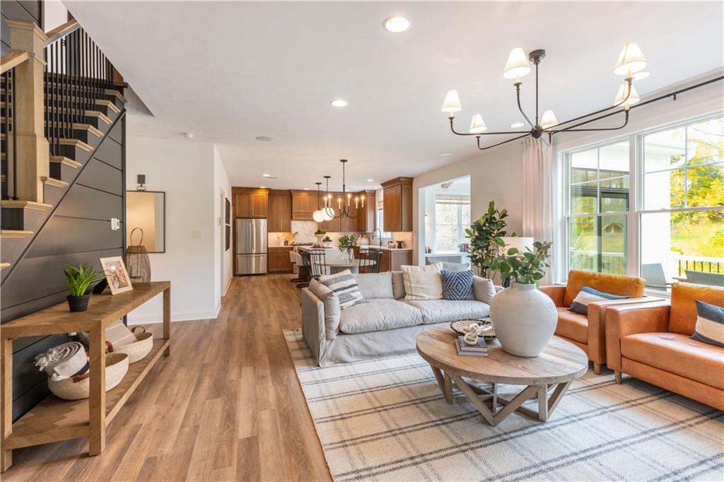 5136 Cline Hollow Road Export, PA 15632 - Photo 5 of 25 a living room with couches a coffee table and a coffee table with wooden floor
