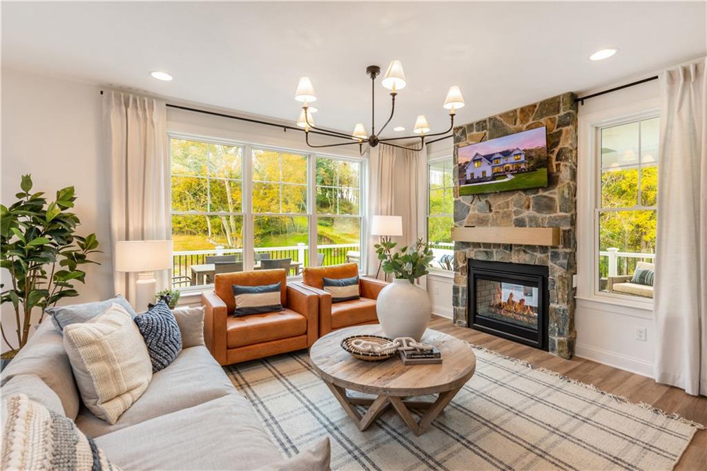 5136 Cline Hollow Road Export, PA 15632 - Photo 8 of 25 a living room with furniture a fireplace and a large window