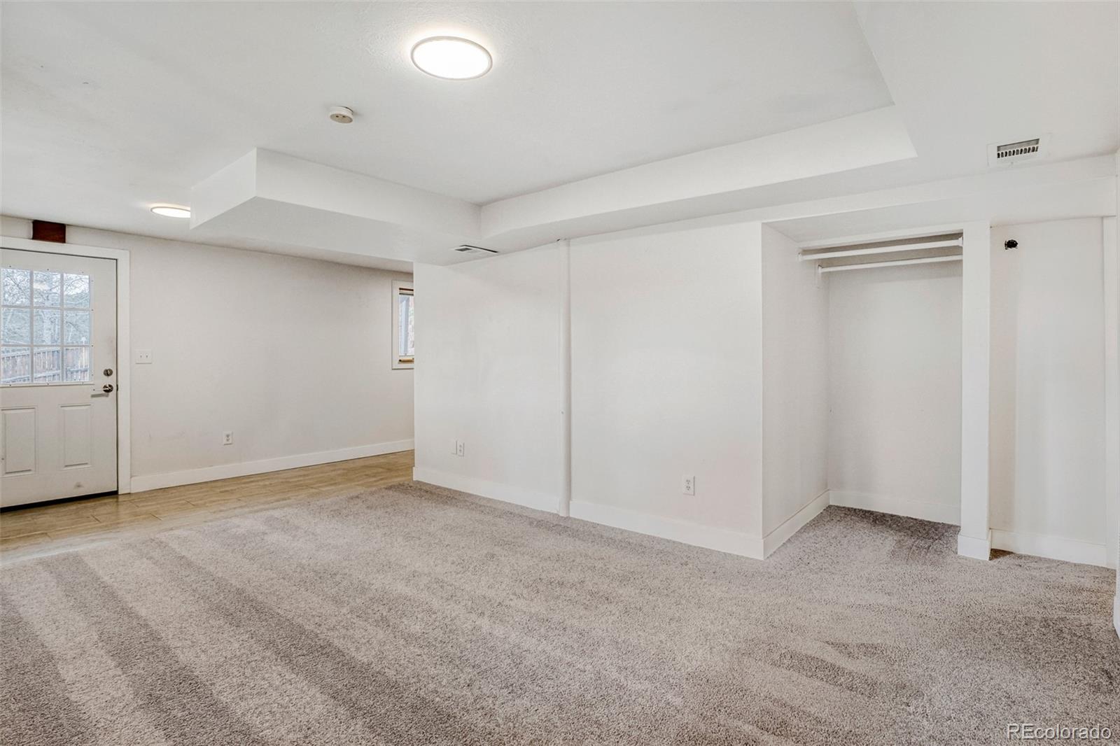 26207 South End Road Kittredge, CO 80457 - Photo 17 of 32 an empty room with a empty space and windows