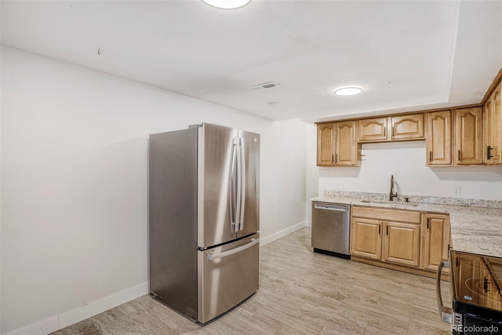 26207 South End Road Kittredge, CO 80457 - Photo 21 of 32 a kitchen with a refrigerator sink and cabinets