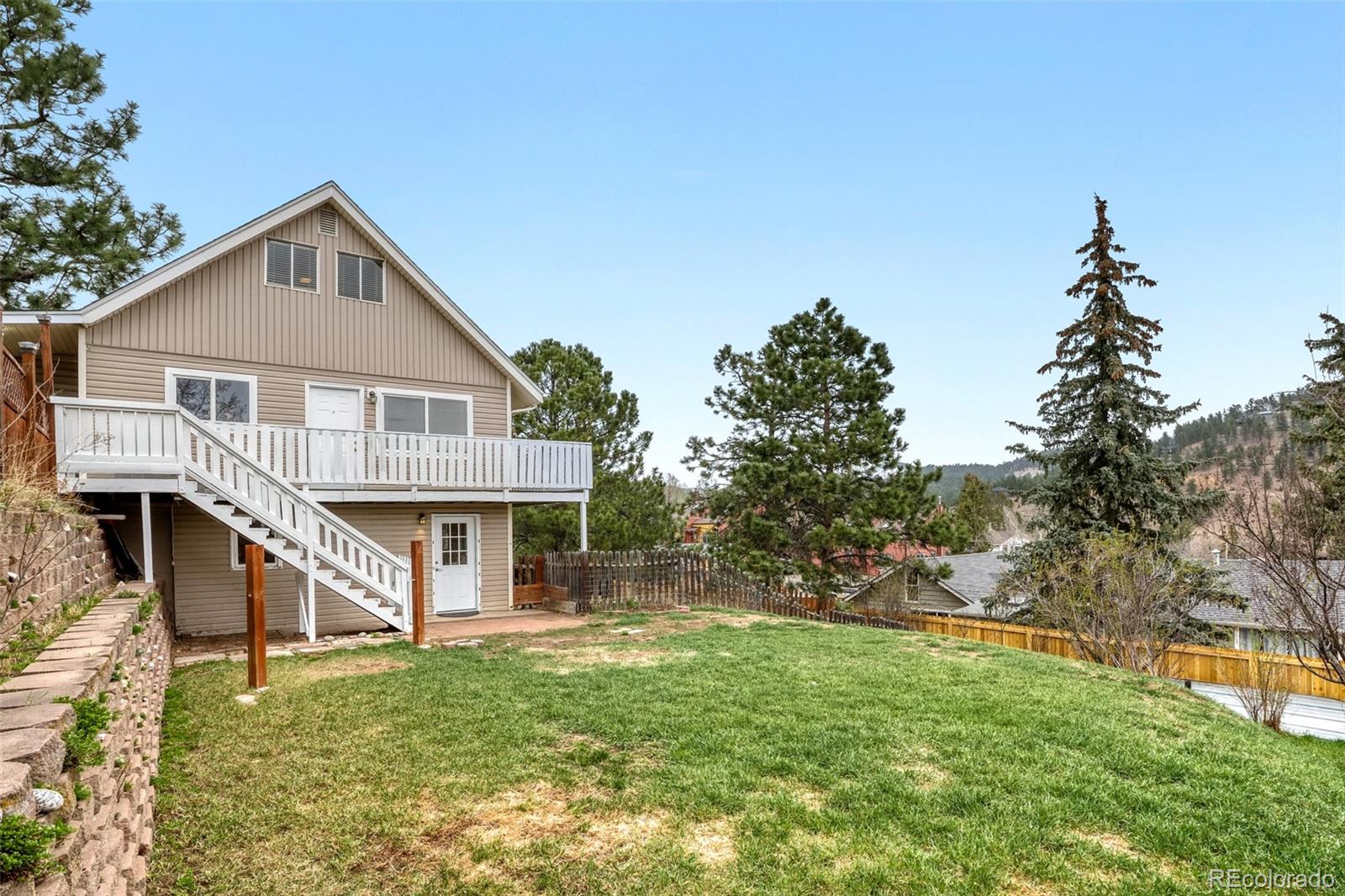 26207 South End Road Kittredge, CO 80457 - Photo 26 of 32 a view of a house with backyard and garden