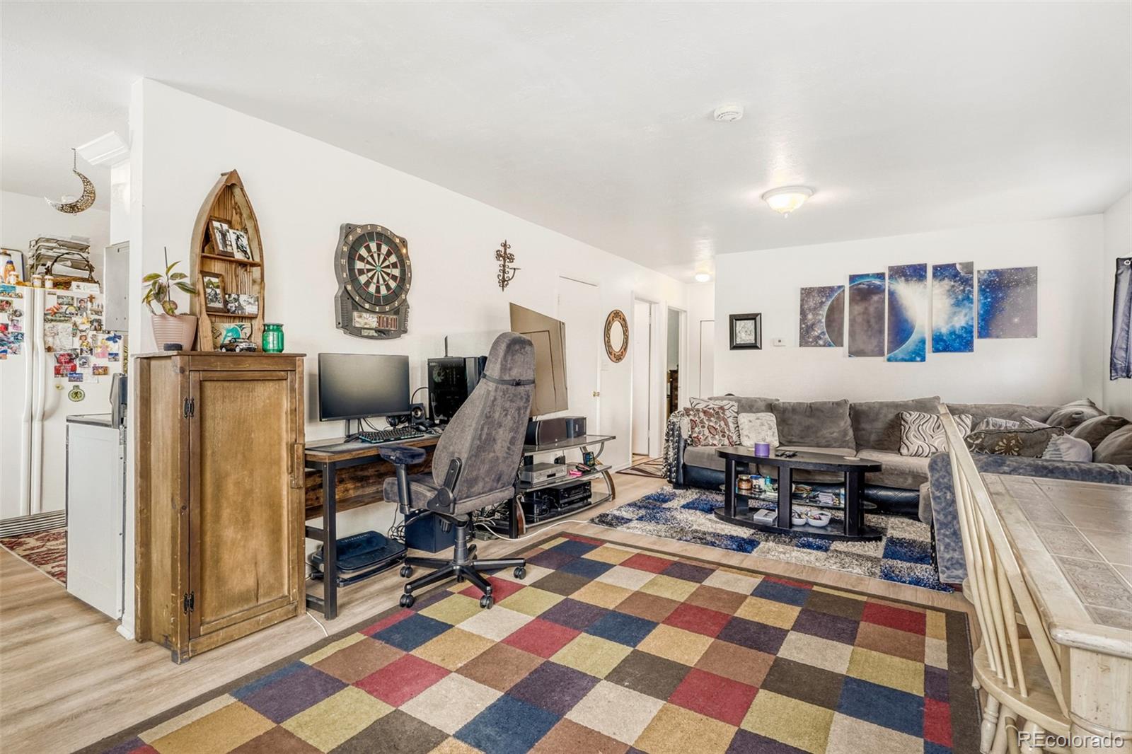 26207 South End Road Kittredge, CO 80457 - Photo 6 of 32 a living room with furniture and a flat screen tv