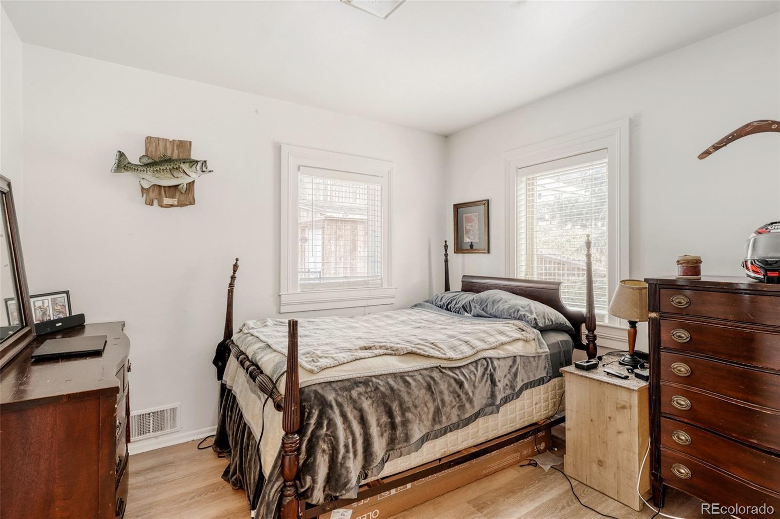 26207 South End Road Kittredge, CO 80457 - Photo 10 of 32 a bedroom with a bed and wooden floor