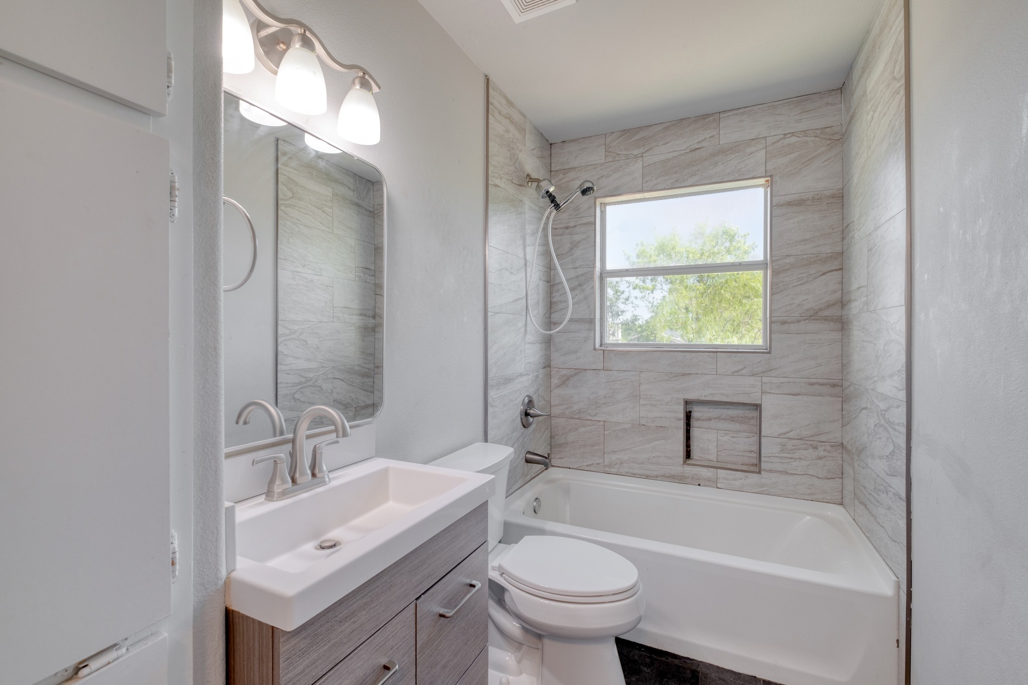 1719 Adina Street Austin, TX 78721 - Photo 16 of 17 Bathroom with vanity and shower combination