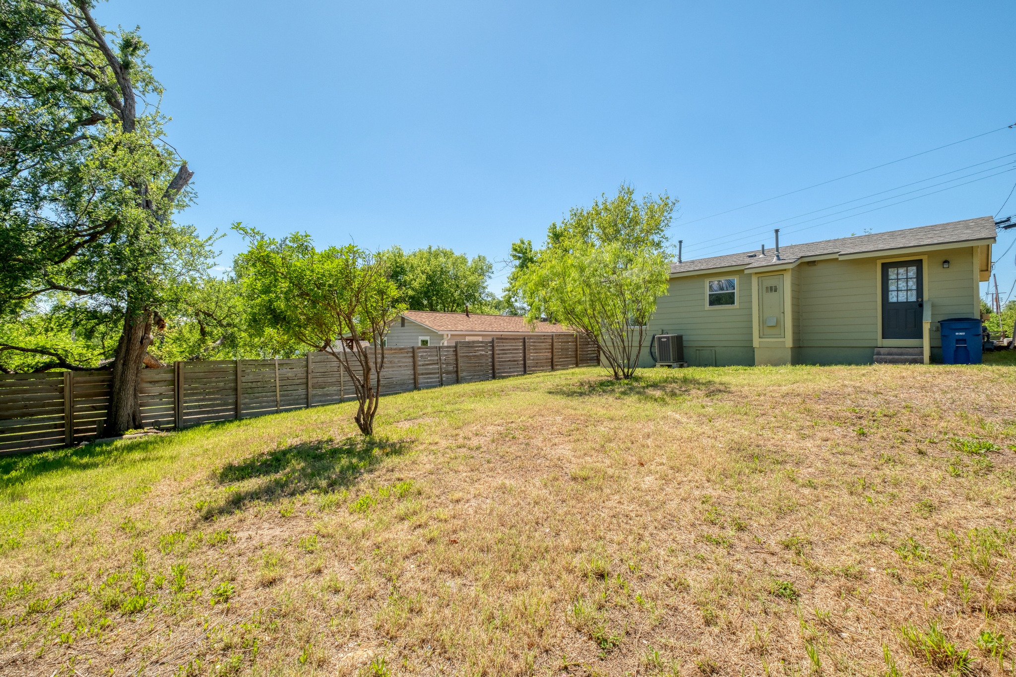 1719 Adina Street Austin, TX 78721 - Photo 2 of 17 Lots of room for the kids to play and the dogs to run.