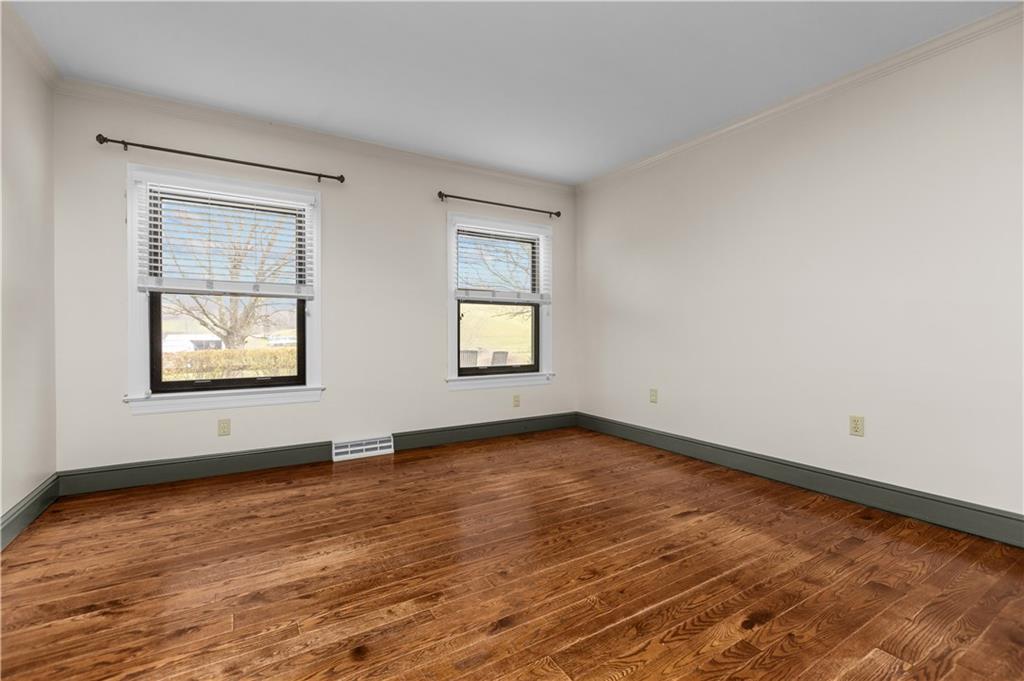 500 Davis School Road Washington, PA 15301 - Photo 11 of 48 an empty room with wooden floor and windows