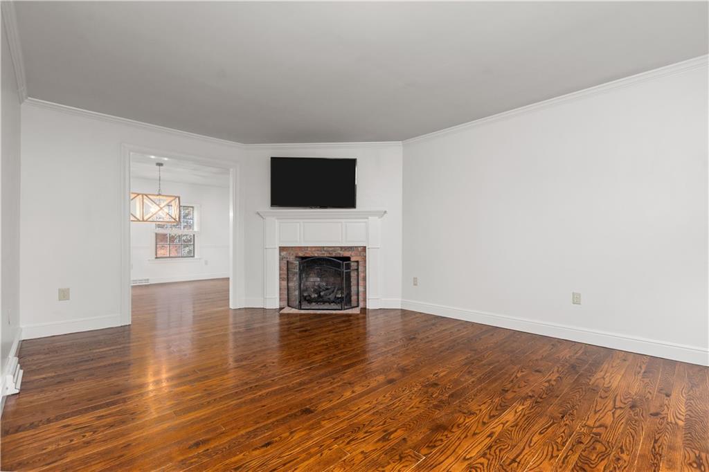 500 Davis School Road Washington, PA 15301 - Photo 12 of 48 a view of an empty room with wooden floor and a fireplace