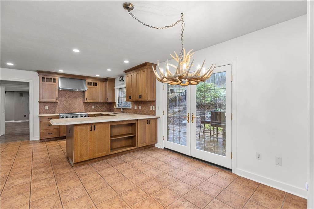 500 Davis School Road Washington, PA 15301 - Photo 17 of 48 a kitchen with stainless steel appliances granite countertop a stove a sink and a refrigerator