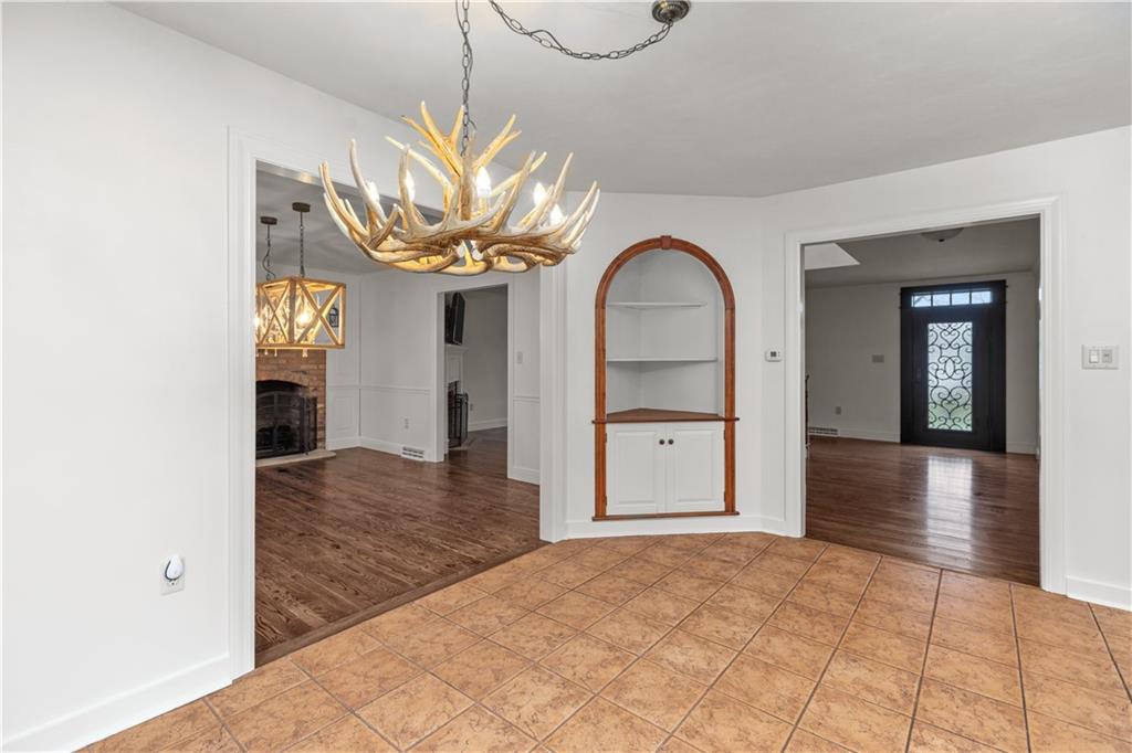 500 Davis School Road Washington, PA 15301 - Photo 18 of 48 a view of a hallway with wooden floor and chandelier