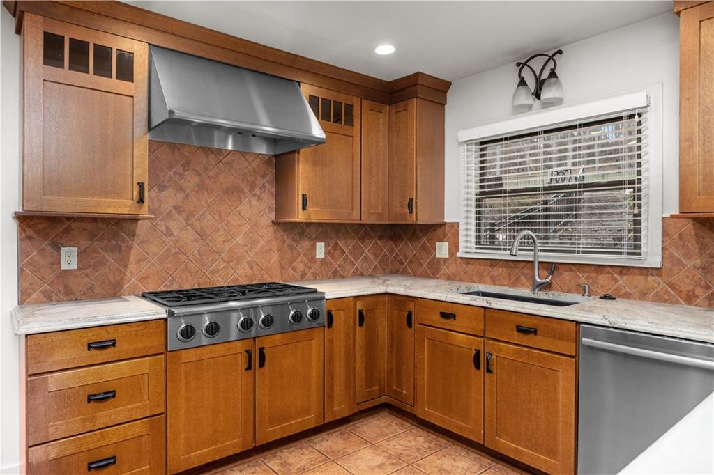 500 Davis School Road Washington, PA 15301 - Photo 21 of 48 a kitchen with stainless steel appliances granite countertop a sink stove and cabinets