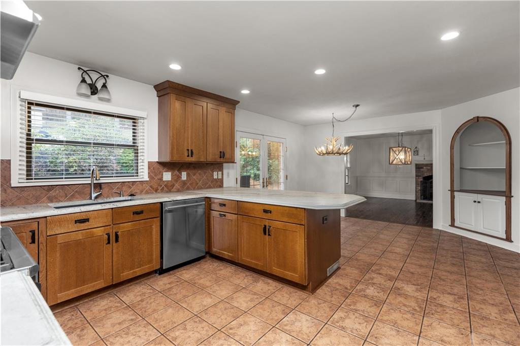 500 Davis School Road Washington, PA 15301 - Photo 23 of 48 a large kitchen with stainless steel appliances granite countertop a stove a sink and a microwave