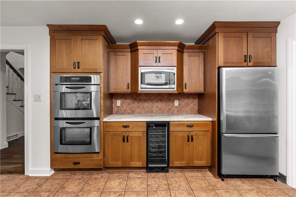 500 Davis School Road Washington, PA 15301 - Photo 24 of 48 a kitchen with stainless steel appliances granite countertop a refrigerator and a stove