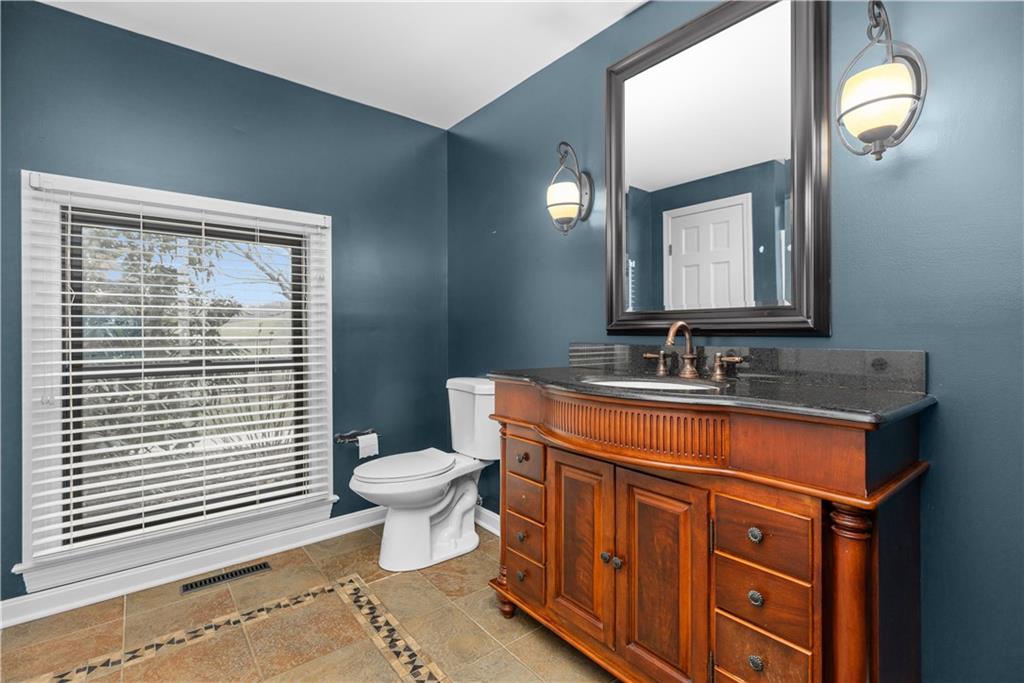 500 Davis School Road Washington, PA 15301 - Photo 28 of 48 a bathroom with a sink a toilet a mirror and shower