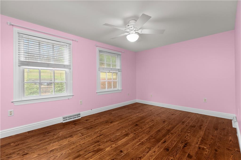 500 Davis School Road Washington, PA 15301 - Photo 31 of 48 a view of an empty room with wooden floor and a window
