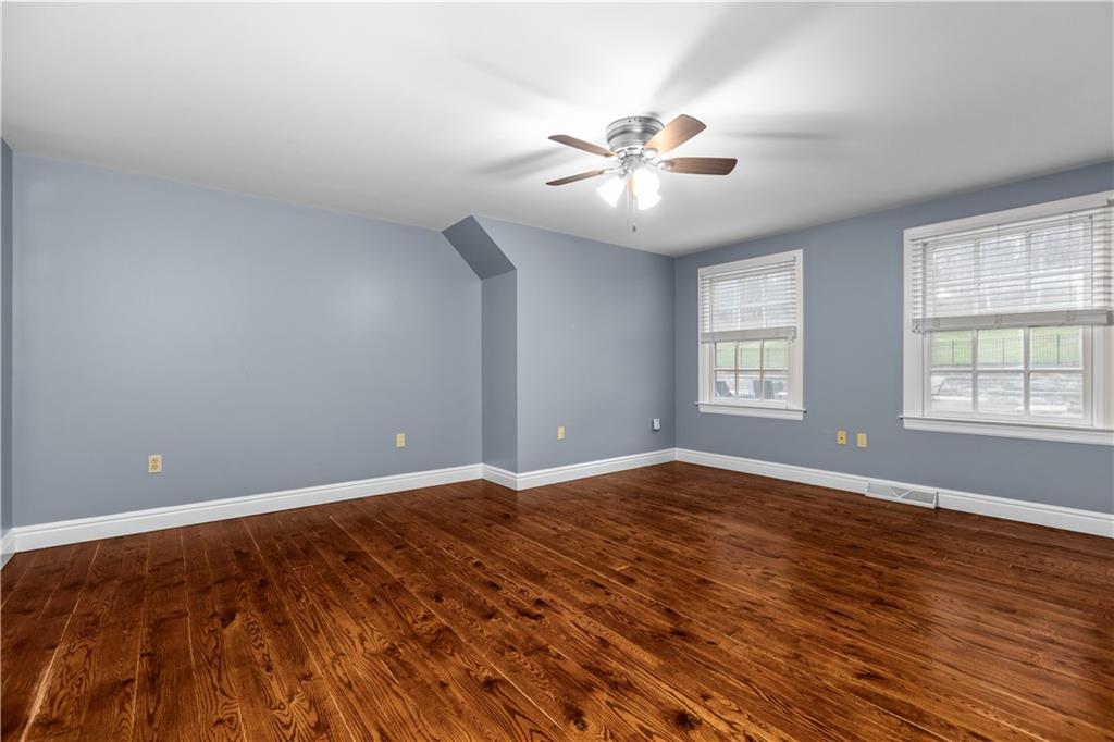 500 Davis School Road Washington, PA 15301 - Photo 36 of 48 a view of an empty room with chandelier fan and wooden floor