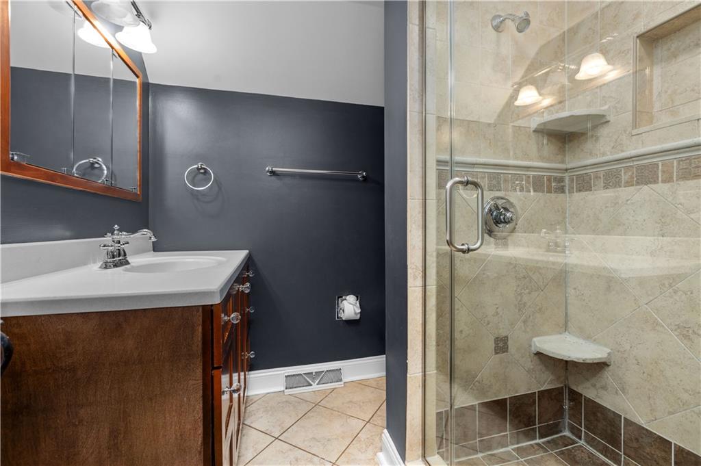 500 Davis School Road Washington, PA 15301 - Photo 38 of 48 a bathroom with a sink and mirror