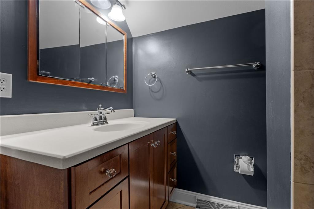 500 Davis School Road Washington, PA 15301 - Photo 39 of 48 a bathroom with a sink vanity and a mirror