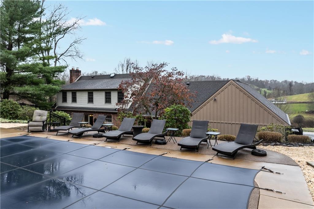 500 Davis School Road Washington, PA 15301 - Photo 47 of 48 a view of a patio with a table and chairs under an umbrella